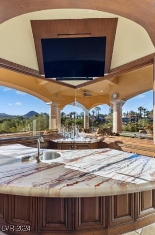 view of patio / terrace featuring a hot tub and sink