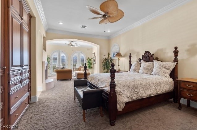 bedroom with ceiling fan, carpet floors, and crown molding