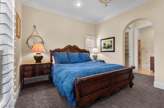 carpeted bedroom featuring ornamental molding