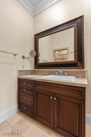 bathroom featuring crown molding, vanity, and tile patterned floors