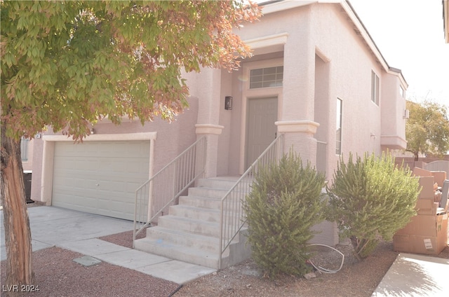 view of front of property with a garage