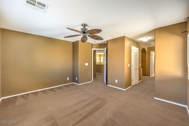 unfurnished room featuring carpet flooring and ceiling fan