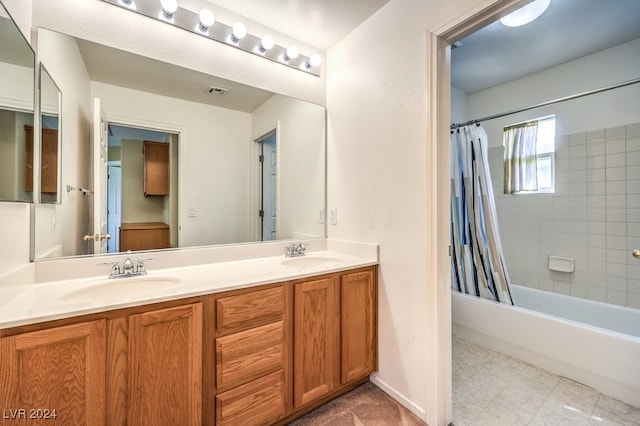 bathroom featuring vanity and shower / bath combo with shower curtain