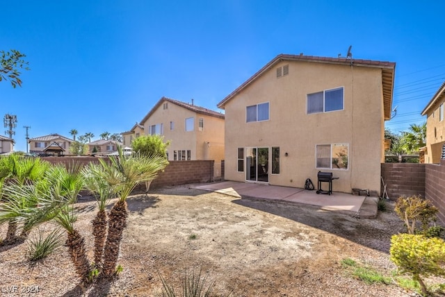 back of house featuring a patio area