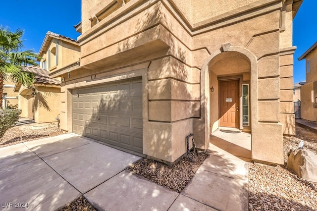 view of side of home with a garage