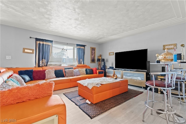 living room featuring wood-type flooring and a textured ceiling