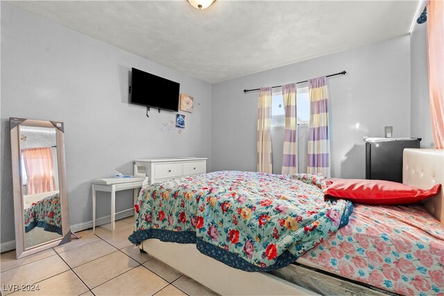 bedroom featuring light tile patterned floors