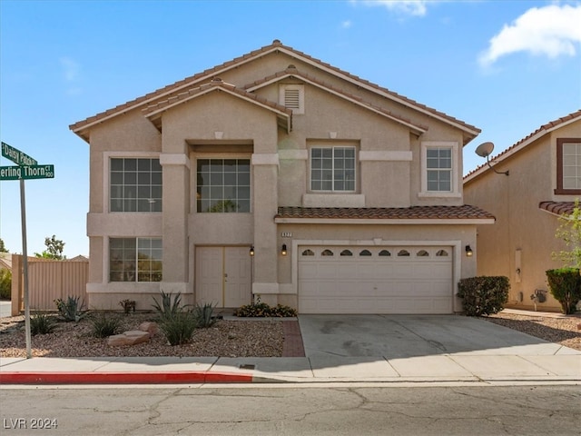 view of front of property with a garage