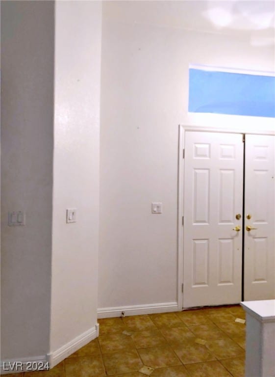 entryway featuring tile patterned flooring