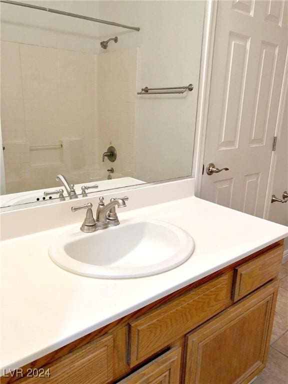 bathroom with tile patterned floors, vanity, and bathtub / shower combination