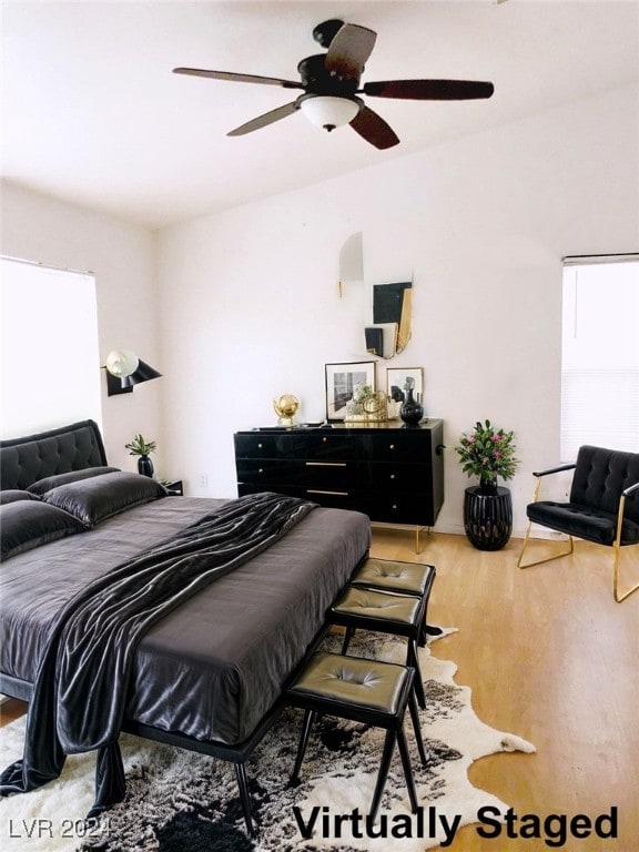 bedroom featuring hardwood / wood-style flooring and ceiling fan