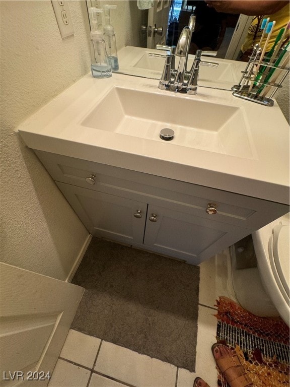 bathroom with vanity and tile patterned flooring