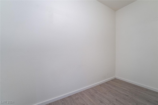 unfurnished room with light hardwood / wood-style floors