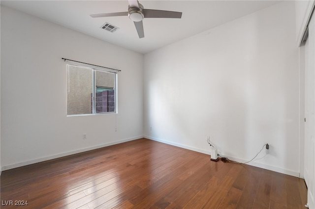 empty room featuring ceiling fan and hardwood / wood-style flooring