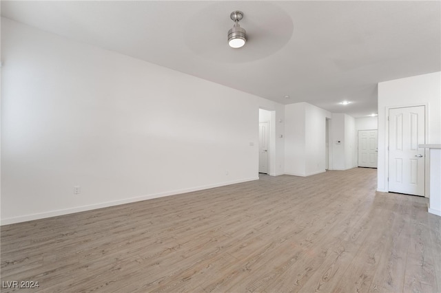 spare room with ceiling fan and light hardwood / wood-style floors