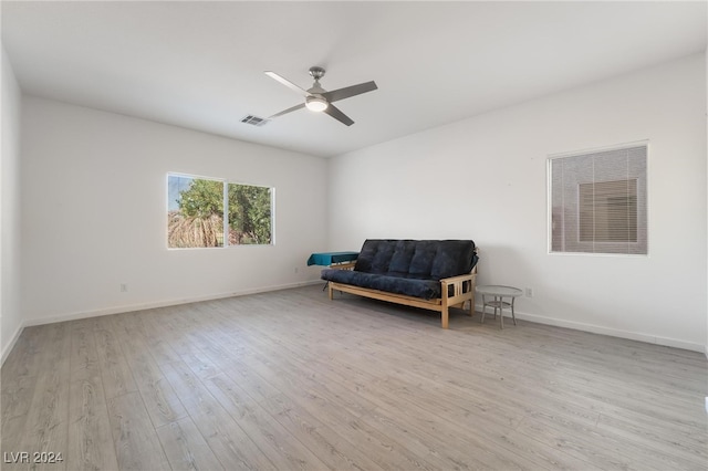 sitting room featuring light hardwood / wood-style floors and ceiling fan