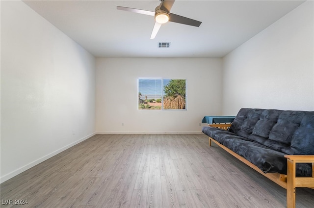 unfurnished room with ceiling fan and light hardwood / wood-style flooring