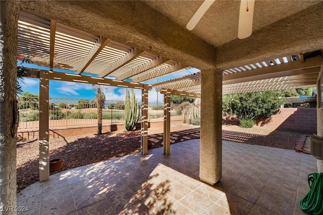 view of patio with ceiling fan and a pergola