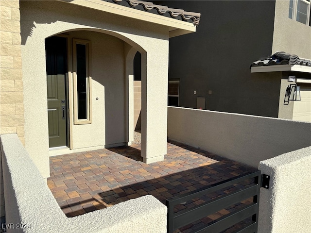 doorway to property featuring a patio