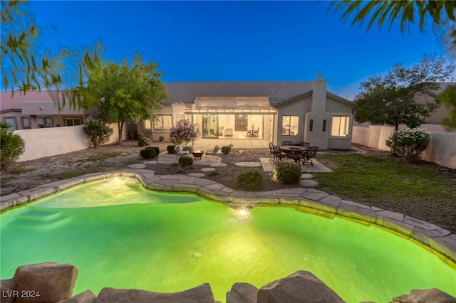 view of swimming pool with a patio area