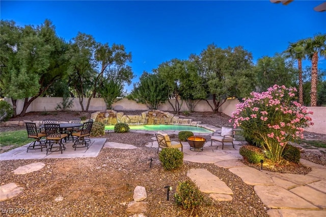 view of yard featuring a fenced in pool and a patio