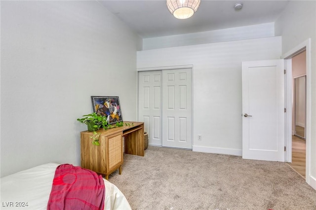 carpeted bedroom featuring a closet