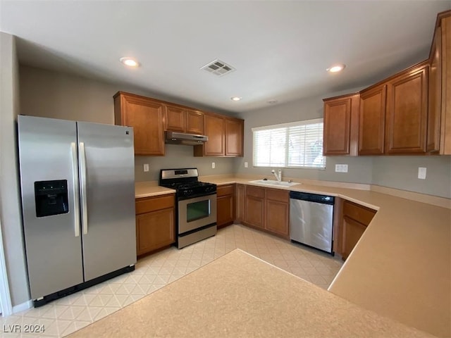 kitchen with appliances with stainless steel finishes and sink