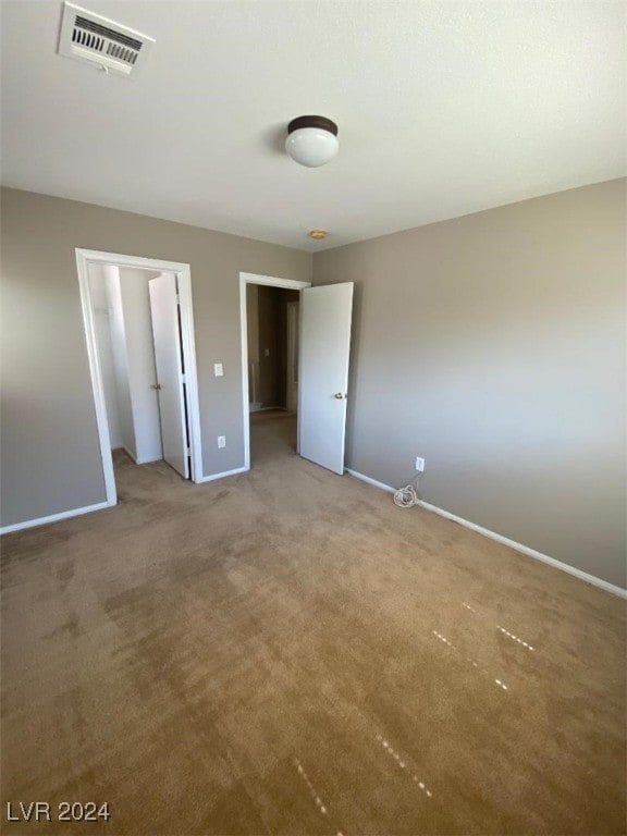 unfurnished bedroom with carpet flooring