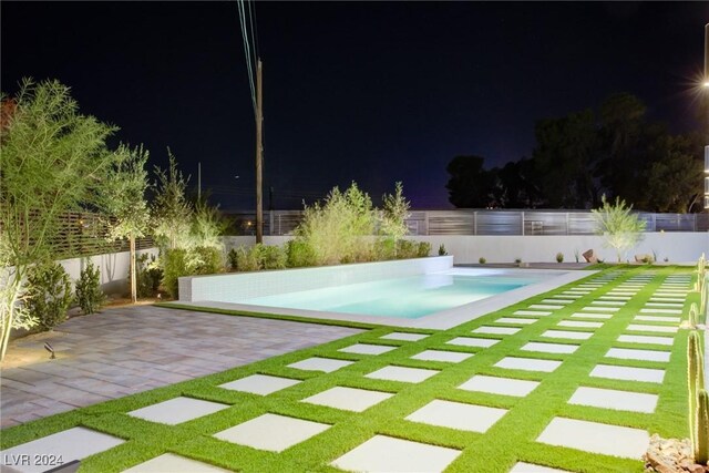 view of swimming pool featuring a fenced backyard, a fenced in pool, and a patio