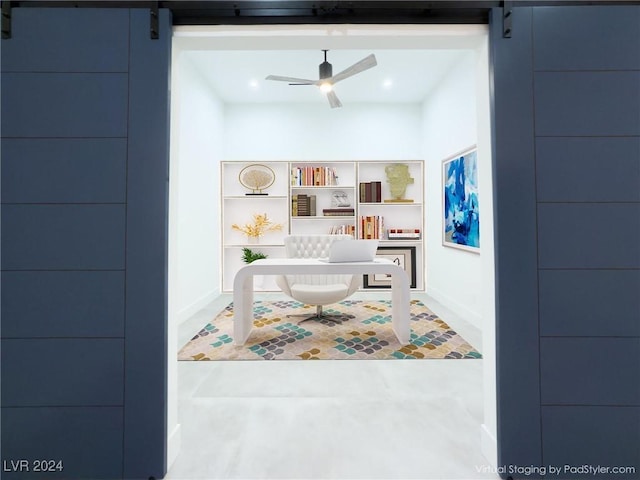 office area featuring built in shelves, a barn door, a ceiling fan, and recessed lighting