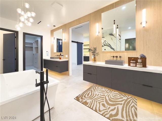 full bathroom featuring a soaking tub, wood walls, two vanities, and a sink