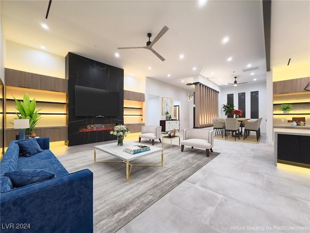 living room featuring ceiling fan and recessed lighting