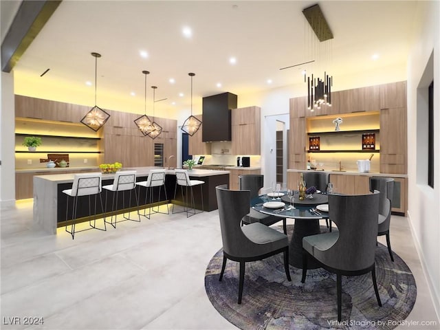 dining space featuring recessed lighting and a towering ceiling