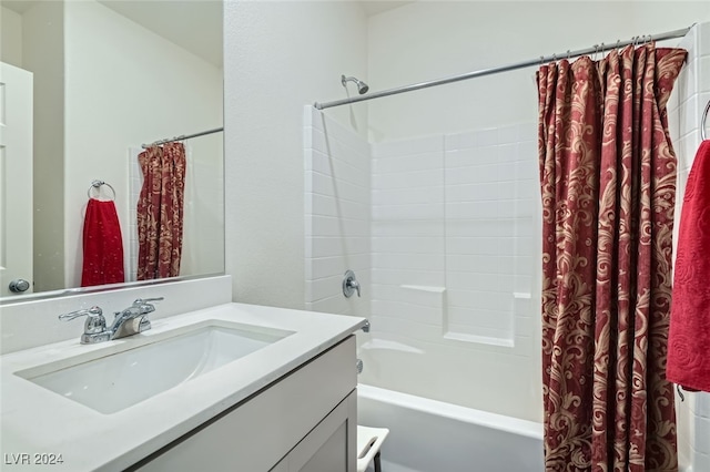 bathroom featuring vanity and shower / bath combo with shower curtain