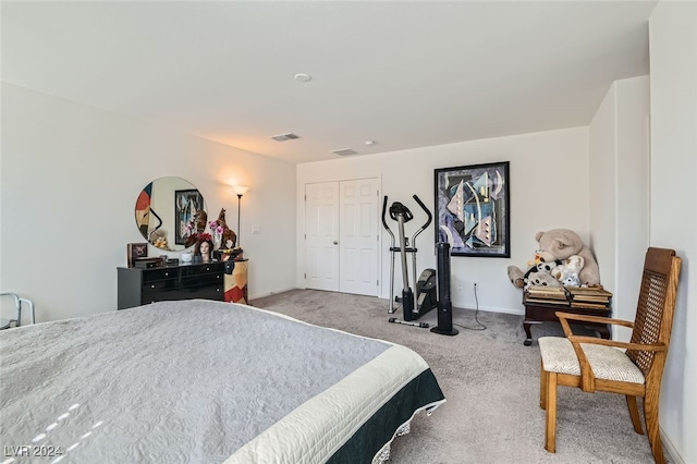 carpeted bedroom with a closet