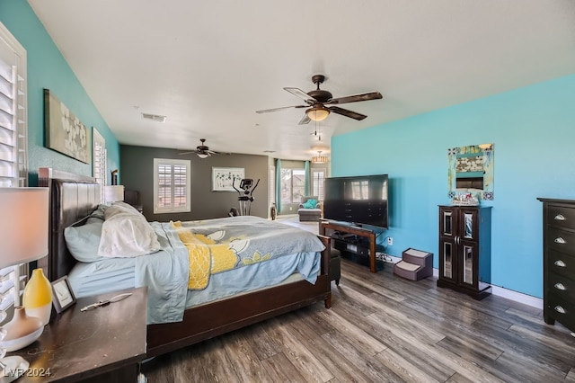 bedroom with hardwood / wood-style flooring and ceiling fan