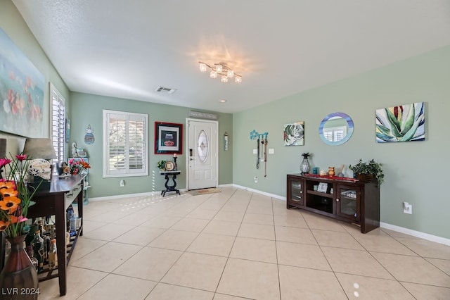 foyer entrance featuring light tile patterned floors