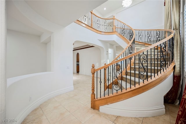 staircase featuring tile patterned floors