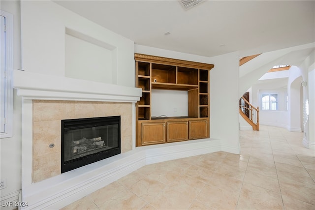 unfurnished living room with light tile patterned flooring