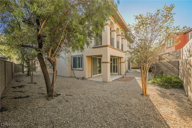 back of property with a patio area