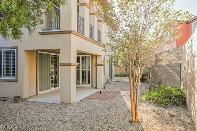 exterior space featuring a balcony and a patio