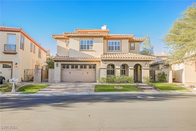 mediterranean / spanish house with a garage