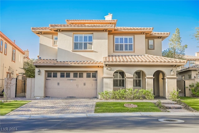 mediterranean / spanish-style house featuring a garage