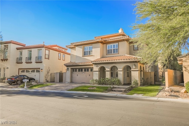 mediterranean / spanish-style home with a garage