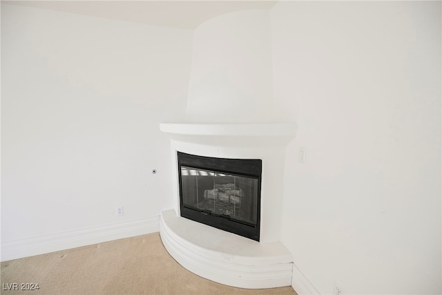 interior details with carpet and a fireplace