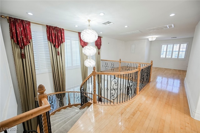 corridor featuring hardwood / wood-style floors