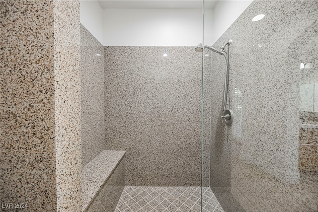 bathroom with a tile shower