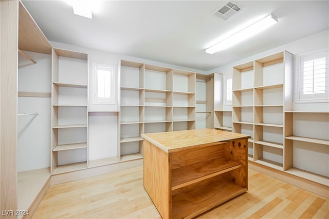 walk in closet featuring light hardwood / wood-style floors