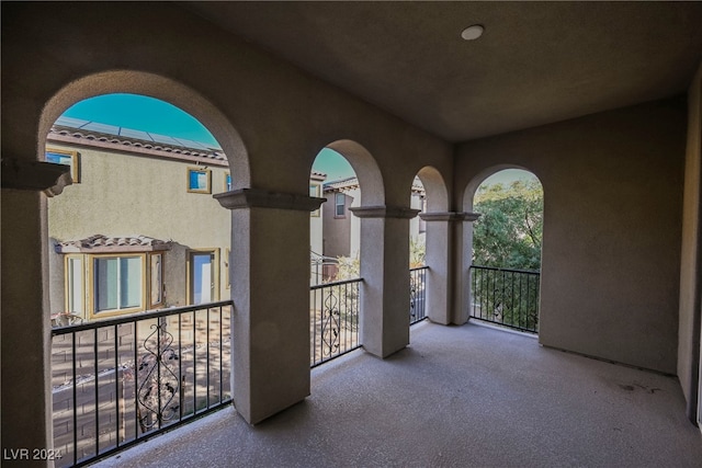 view of patio featuring a balcony