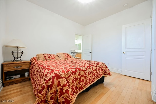 bedroom with hardwood / wood-style flooring